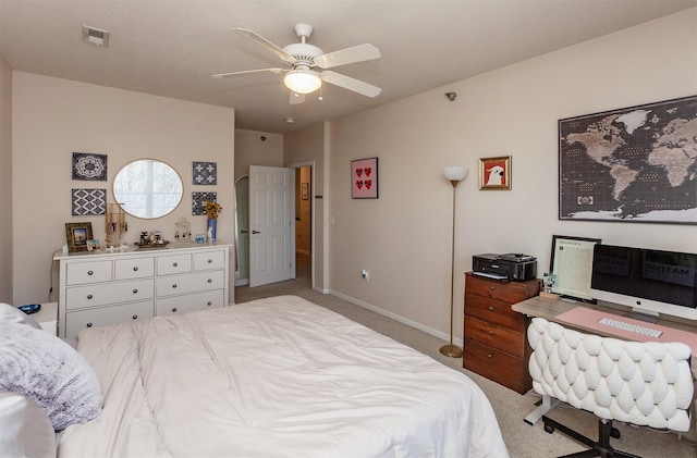 bedroom featuring baseboards, visible vents, ceiling fan, and light colored carpet