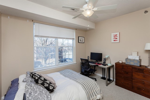 carpeted bedroom featuring visible vents and a ceiling fan