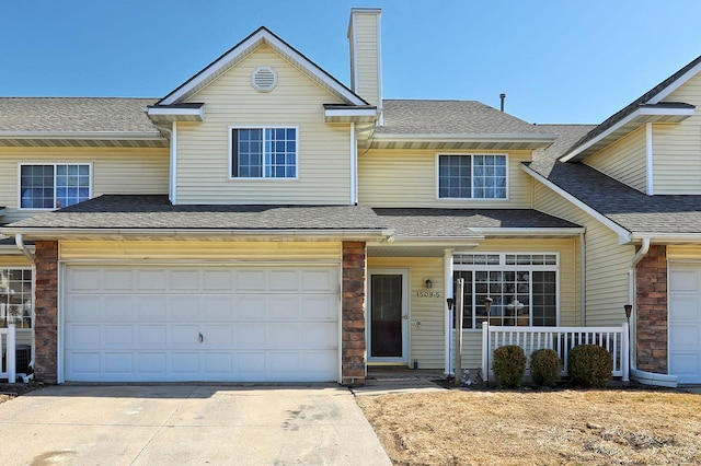 view of front of home with driveway, a shingled roof, a chimney, and a porch