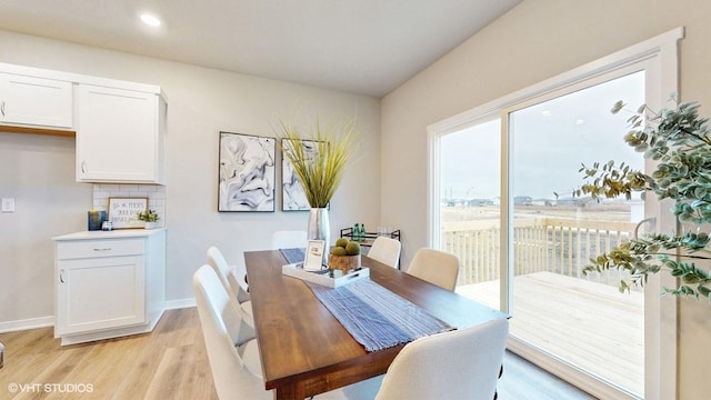 dining room featuring recessed lighting, light wood-style flooring, and baseboards