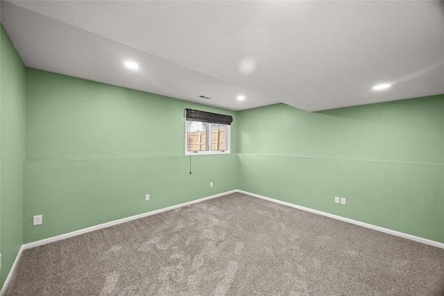 below grade area featuring baseboards, carpet flooring, visible vents, and recessed lighting