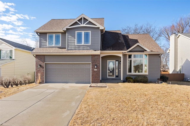 view of front of house featuring driveway, brick siding, roof with shingles, and an attached garage