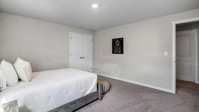 bedroom with carpet floors, visible vents, and baseboards