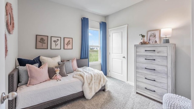 bedroom with carpet flooring and baseboards