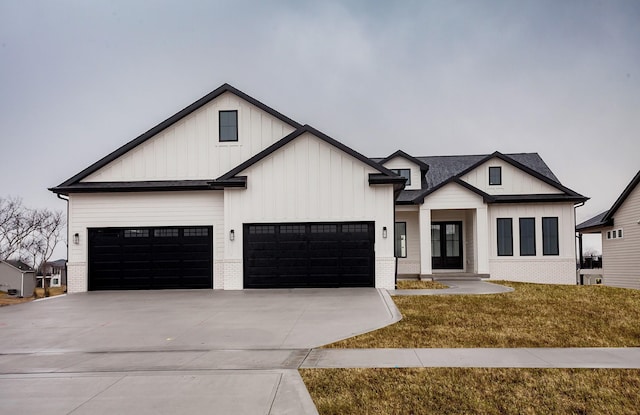 4744 144th St, Urbandale, IA 50323 - modern farmhouse style home with driveway, a front lawn, board and batten siding, brick siding, and a garage