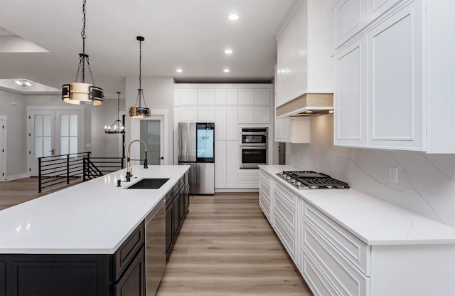 4744 144th St, Urbandale, IA 50323 - kitchen featuring stainless steel appliances, white cabinetry, light wood-style flooring, and recessed lighting