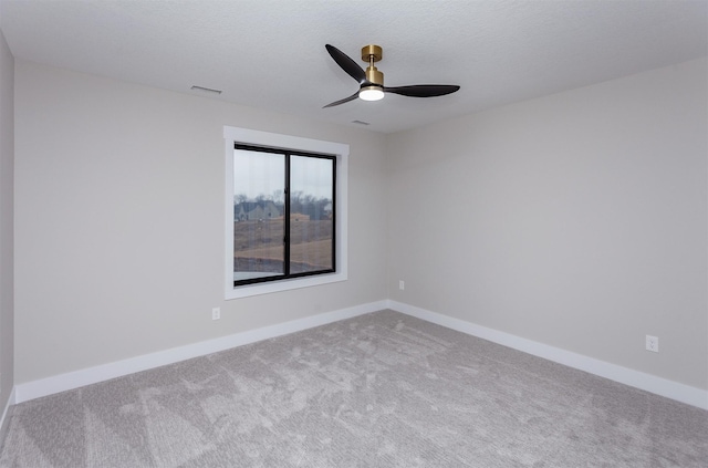 4744 144th St, Urbandale, IA 50323 - spare room featuring carpet flooring and a ceiling fan