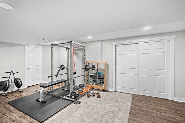 8001 Brookview Dr, Urbandale, IA 50322 - exercise area with wood finished floors, baseboards, and recessed lighting