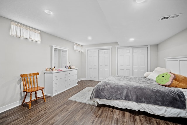 8001 Brookview Dr, Urbandale, IA 50322 - bedroom featuring baseboards, two closets, wood finished floors, and recessed lighting