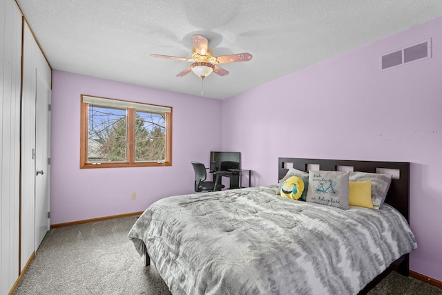 8001 Brookview Dr, Urbandale, IA 50322 - carpeted bedroom featuring baseboards, a textured ceiling, and ceiling fan
