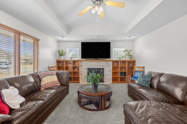 living area featuring ceiling fan, lofted ceiling, and carpet floors