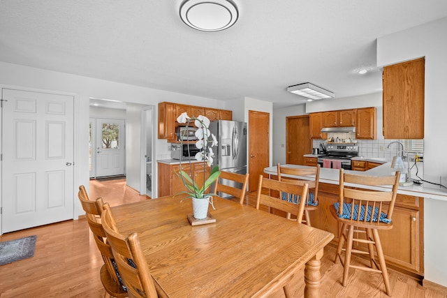 8001 Brookview Dr, Urbandale, IA 50322 - dining area with light wood finished floors