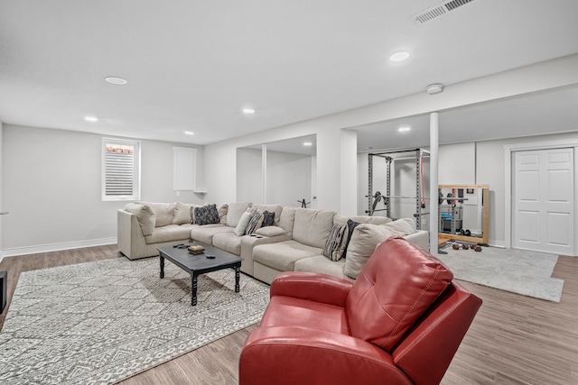 8001 Brookview Dr, Urbandale, IA 50322 - living room with wood finished floors, recessed lighting, and baseboards