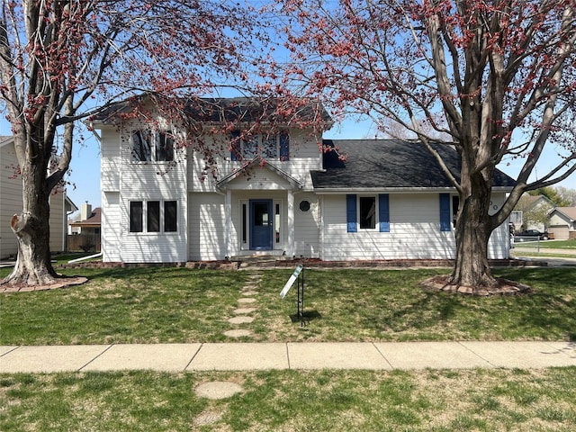 traditional home with a front lawn