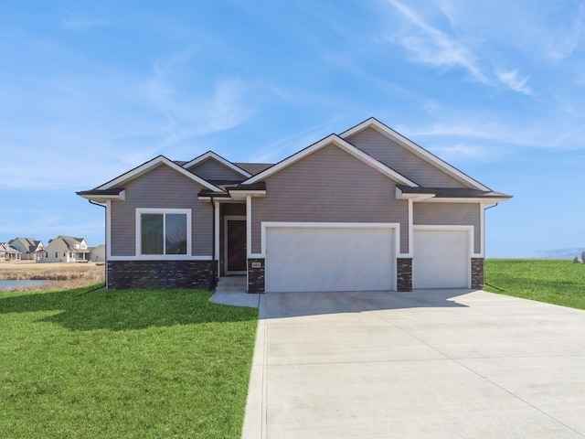 craftsman house featuring an attached garage, stone siding, driveway, and a front yard