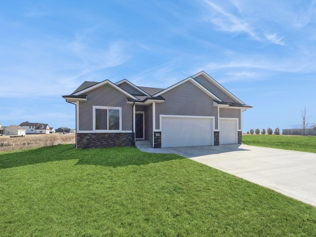 view of front of home featuring an attached garage, stone siding, concrete driveway, and a front yard