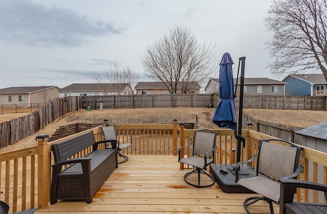 deck with a fenced backyard