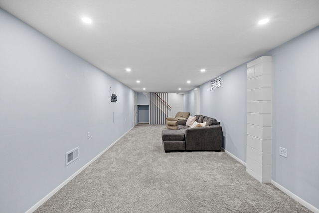 carpeted living room featuring recessed lighting, visible vents, and baseboards