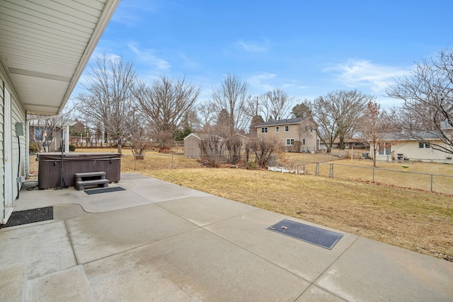 view of patio / terrace with fence and a hot tub