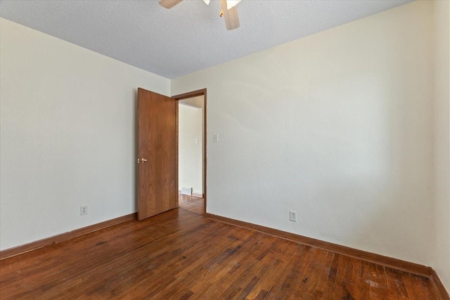 unfurnished room featuring wood-type flooring, baseboards, ceiling fan, and a textured ceiling