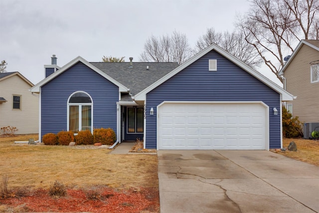 single story home with a garage, central AC, driveway, roof with shingles, and a front lawn