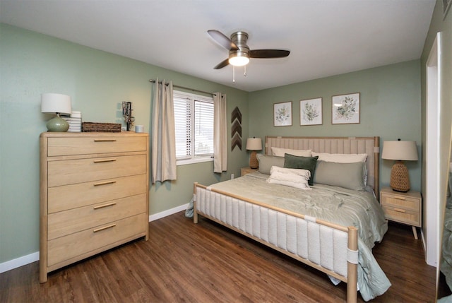 bedroom featuring dark wood-style floors, visible vents, a ceiling fan, and baseboards