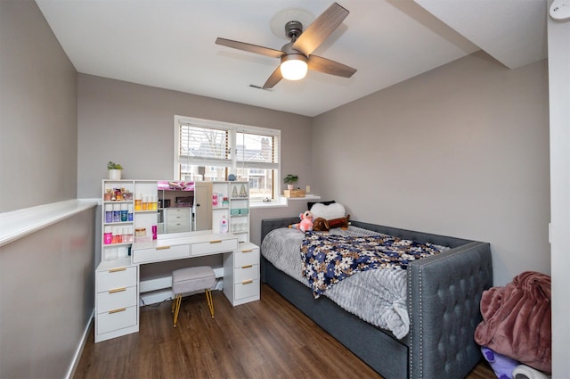 bedroom featuring ceiling fan, visible vents, and wood finished floors