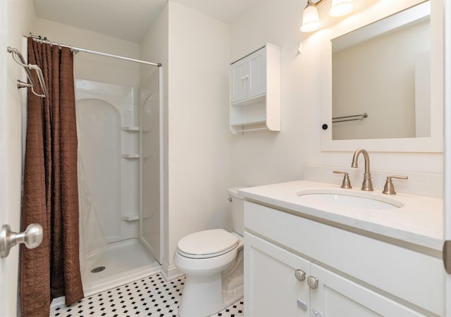 full bath with toilet, a shower stall, vanity, and tile patterned floors