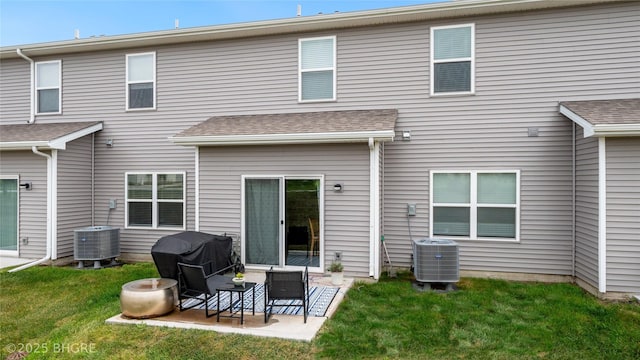 back of house with a patio area, central AC unit, and a yard