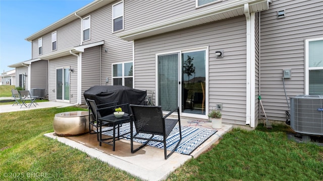 view of patio with grilling area and cooling unit