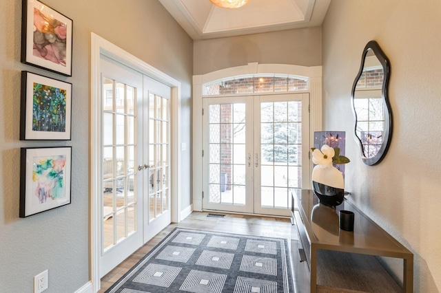 doorway to outside featuring wood finished floors and french doors