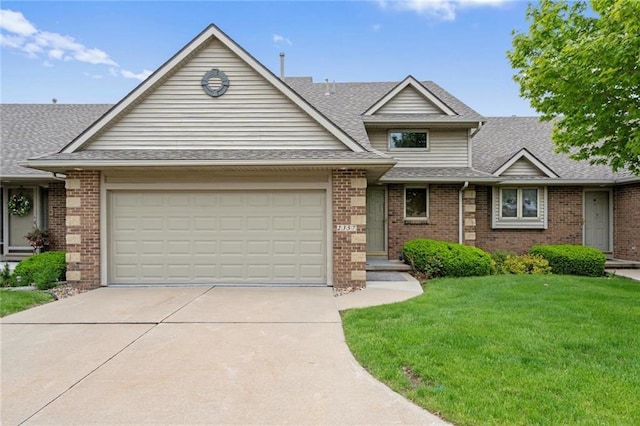 view of front facade featuring a garage, concrete driveway, roof with shingles, a front lawn, and brick siding