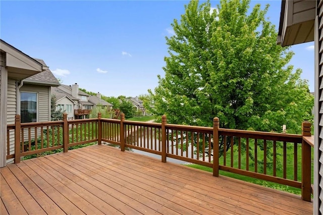 wooden deck featuring a residential view