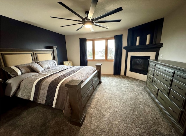 bedroom featuring ceiling fan, a fireplace, and light colored carpet