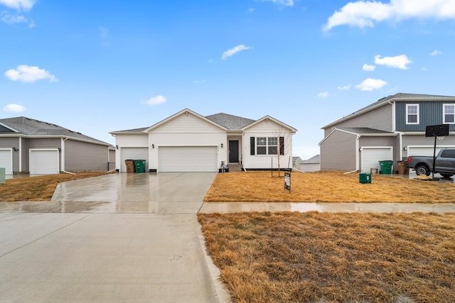 view of front of property with an attached garage and concrete driveway