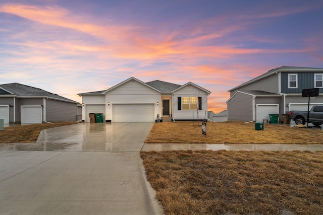 view of front of property featuring a garage and concrete driveway