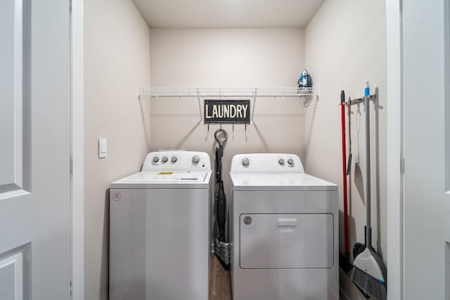 washroom with laundry area and independent washer and dryer