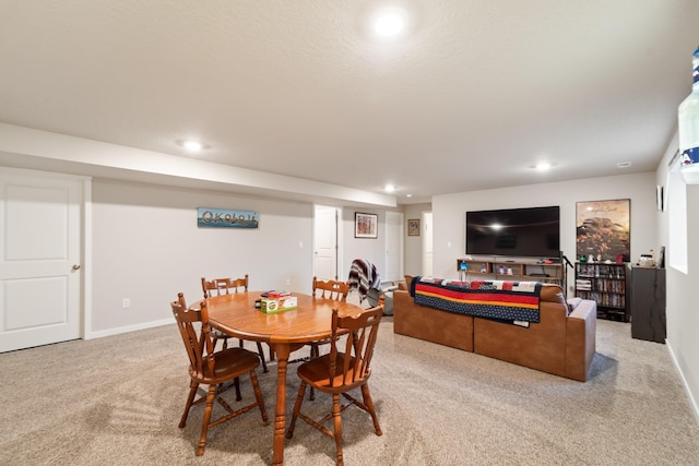 dining room featuring recessed lighting, baseboards, and light colored carpet