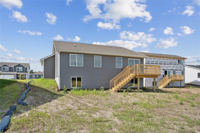 25091 Bluebird Cir, Adel, IA 50003 - rear view of property with stairway and a deck