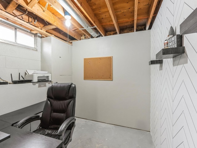 office space with unfinished concrete flooring