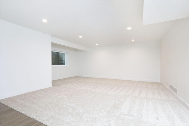 unfurnished room with baseboards, visible vents, and recessed lighting