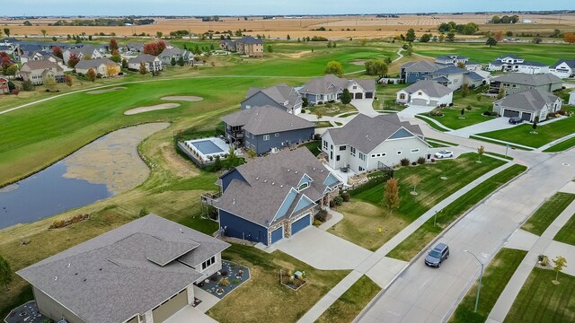 1306 NE 45th St, Ankeny, IA 50021 - aerial perspective of suburban area featuring a nearby body of water and a local golf course