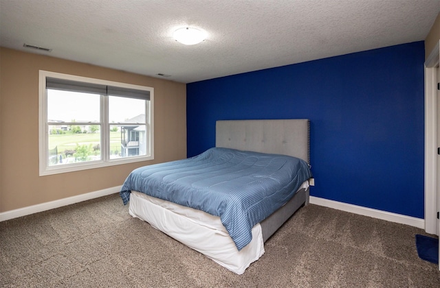 1306 NE 45th St, Ankeny, IA 50021 - carpeted bedroom with baseboards and a textured ceiling