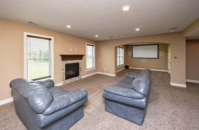 1306 NE 45th St, Ankeny, IA 50021 - living room with carpet flooring, a textured ceiling, healthy amount of natural light, baseboards, and recessed lighting