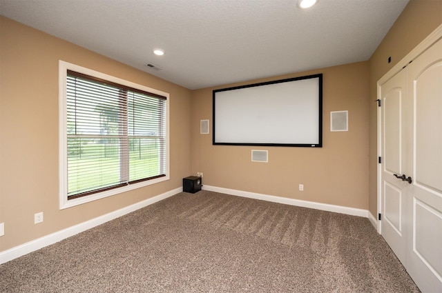 1306 NE 45th St, Ankeny, IA 50021 - carpeted home theater featuring baseboards and recessed lighting