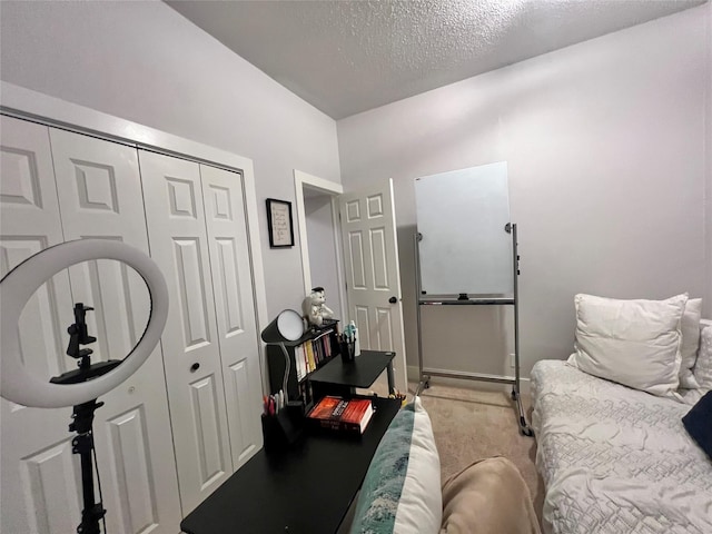 bedroom featuring a closet and a textured ceiling