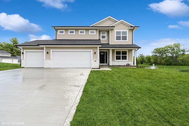 143 10th Ave NE, Altoona, IA 50009 - view of front of house featuring a front lawn, driveway, and stone siding