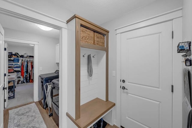 mudroom featuring a textured ceiling