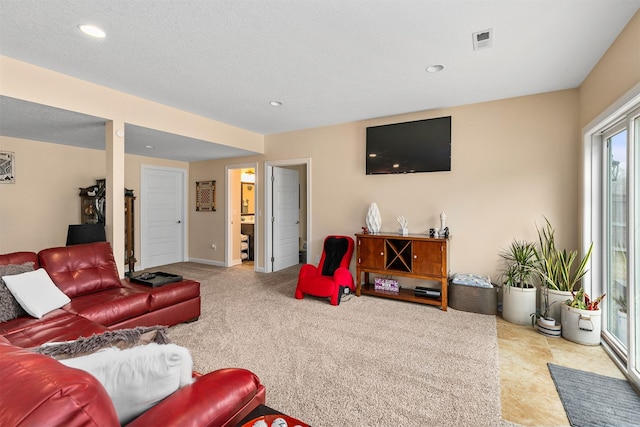 living area with visible vents and recessed lighting