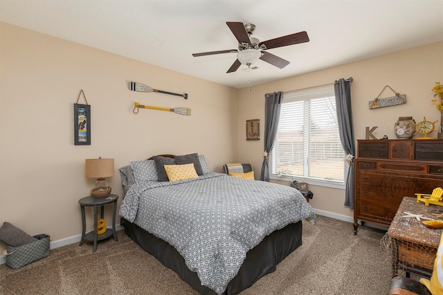 carpeted bedroom featuring ceiling fan and baseboards